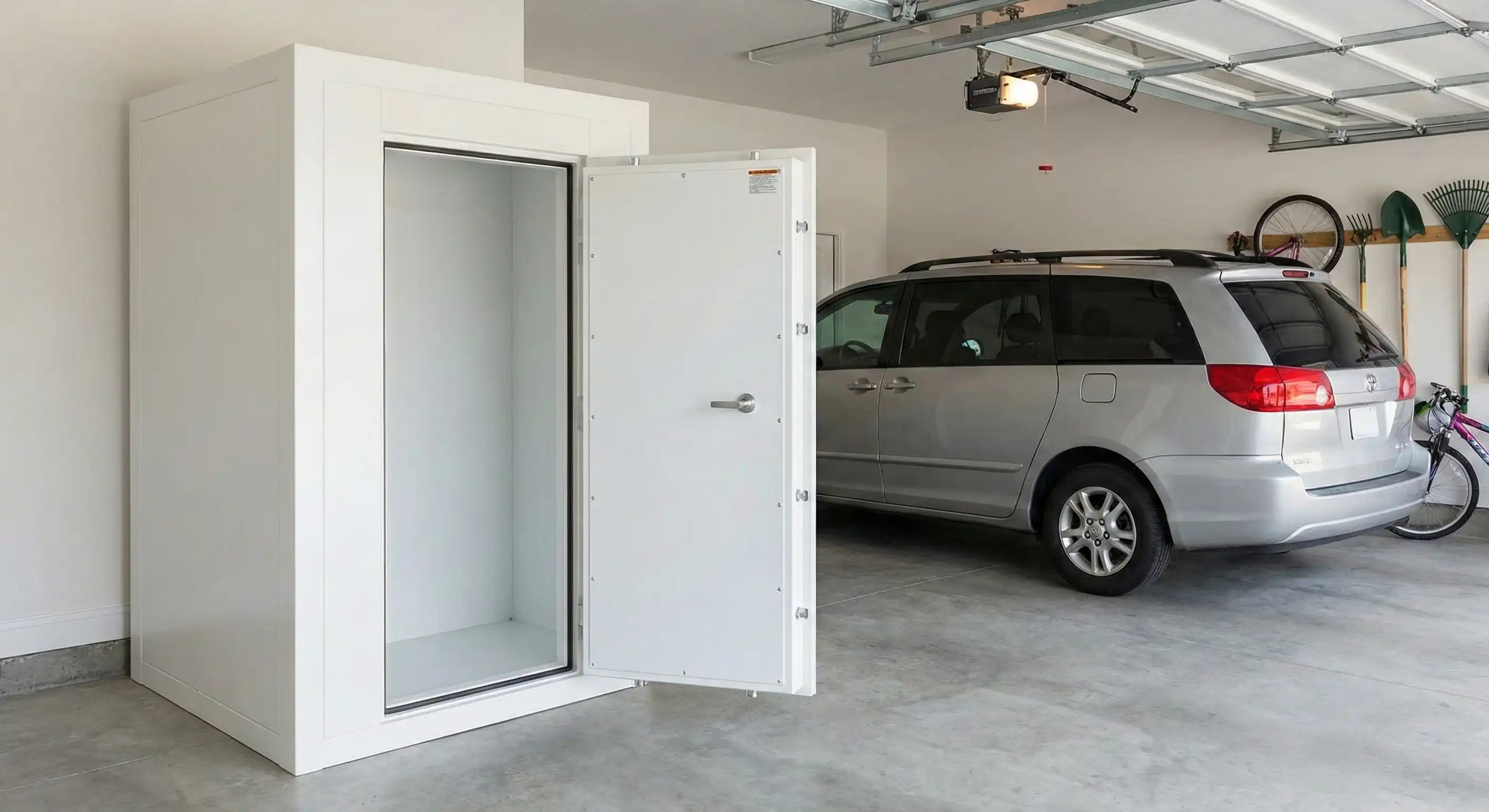 Above-ground steel storm shelter installed in a garage